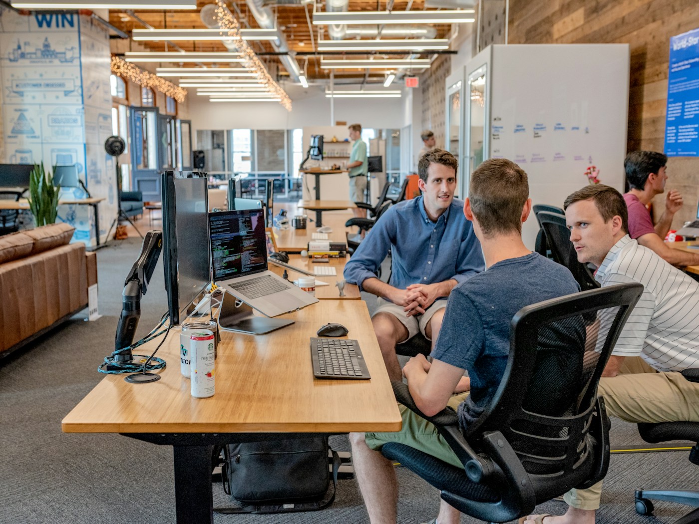 Team reviewing reconciliation checkpoints and month-end AI assist routines around a workshop table